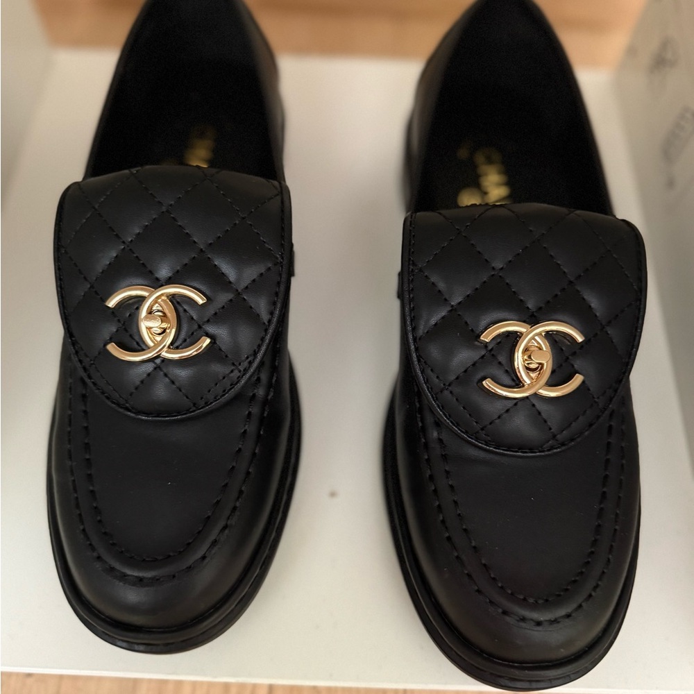 Quilted Black Loafers with Gold Accent